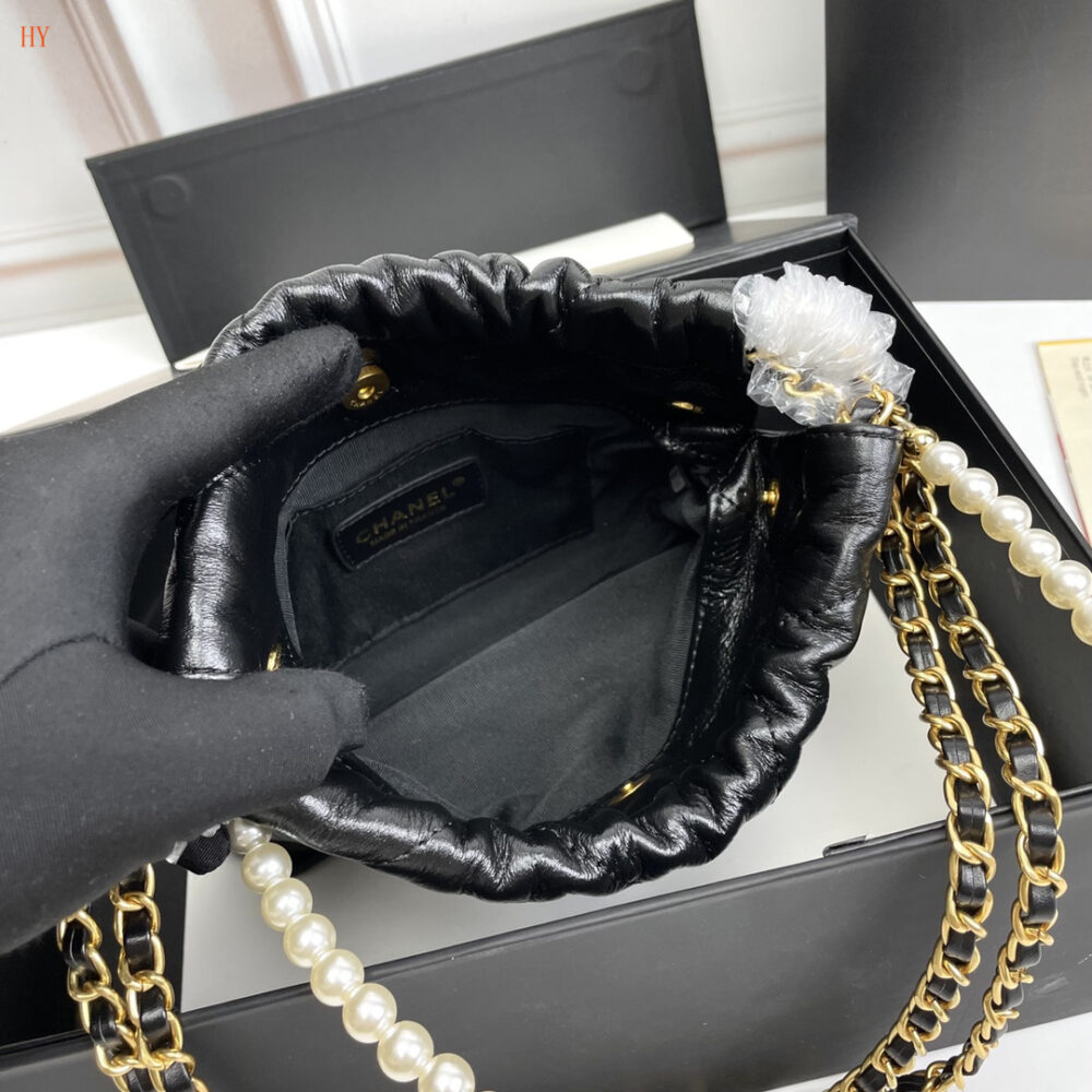 chanel black leather drawstring bag with pearl chain