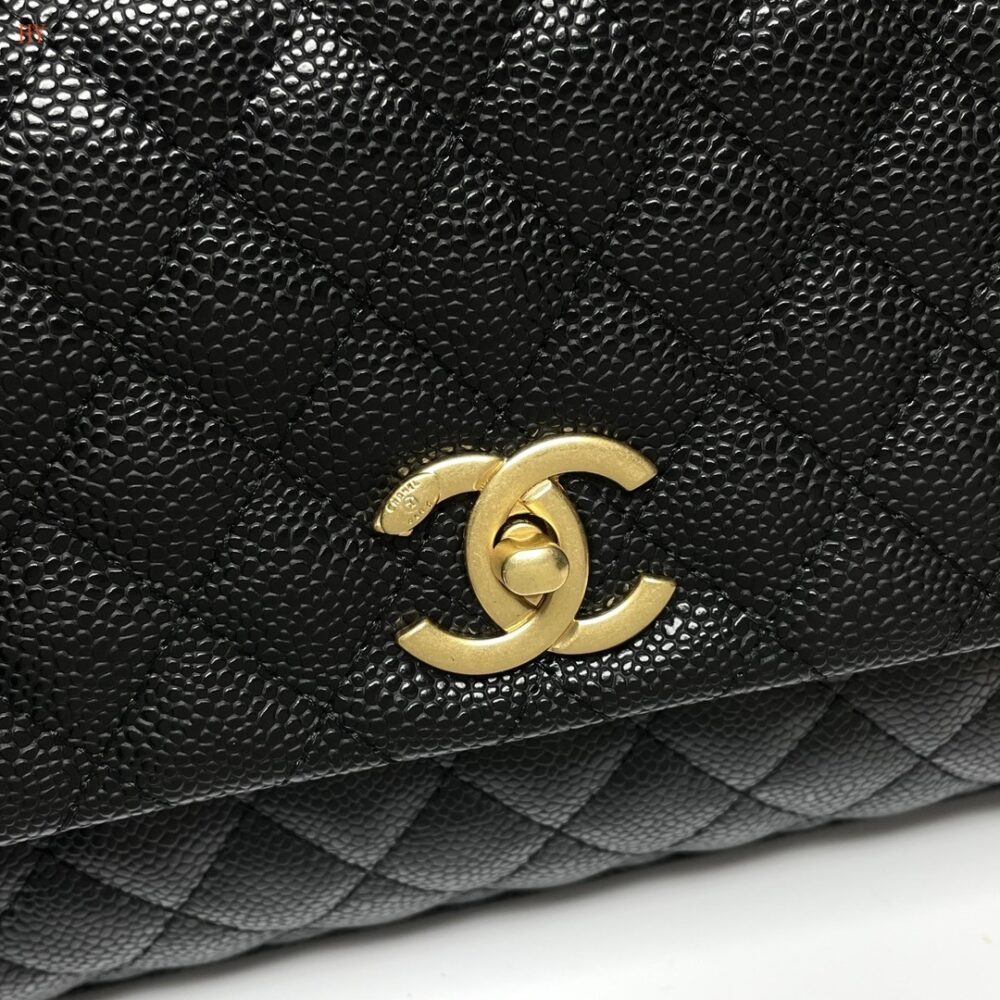 chanel black quilted handbag with gold accents - Image 6