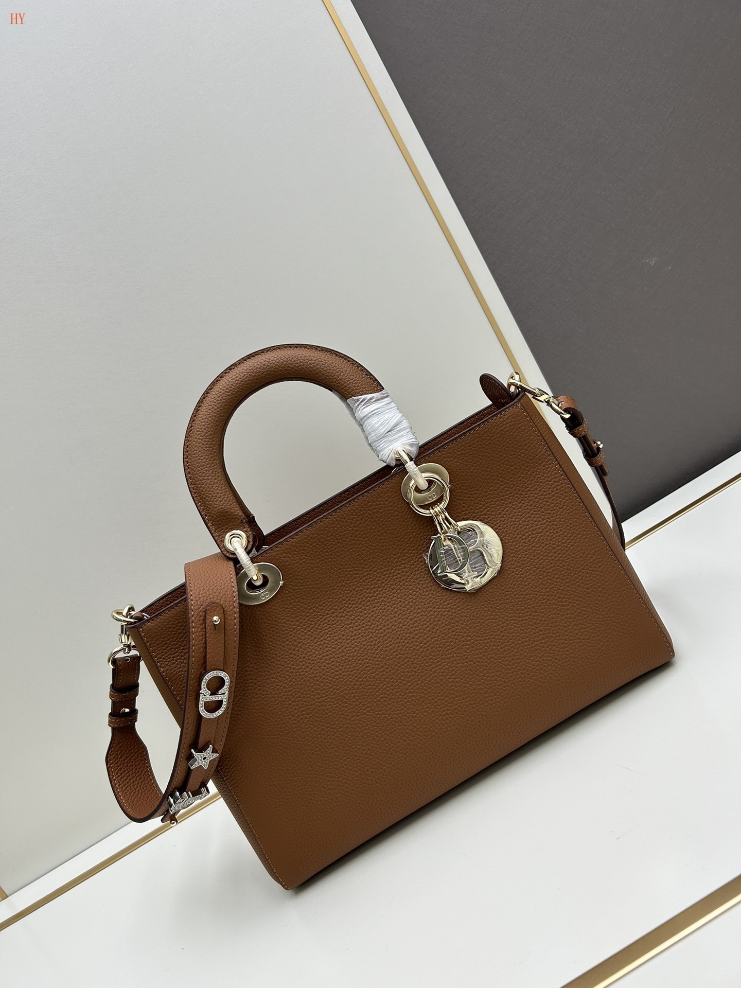 dior brown leather handbag with gold accents